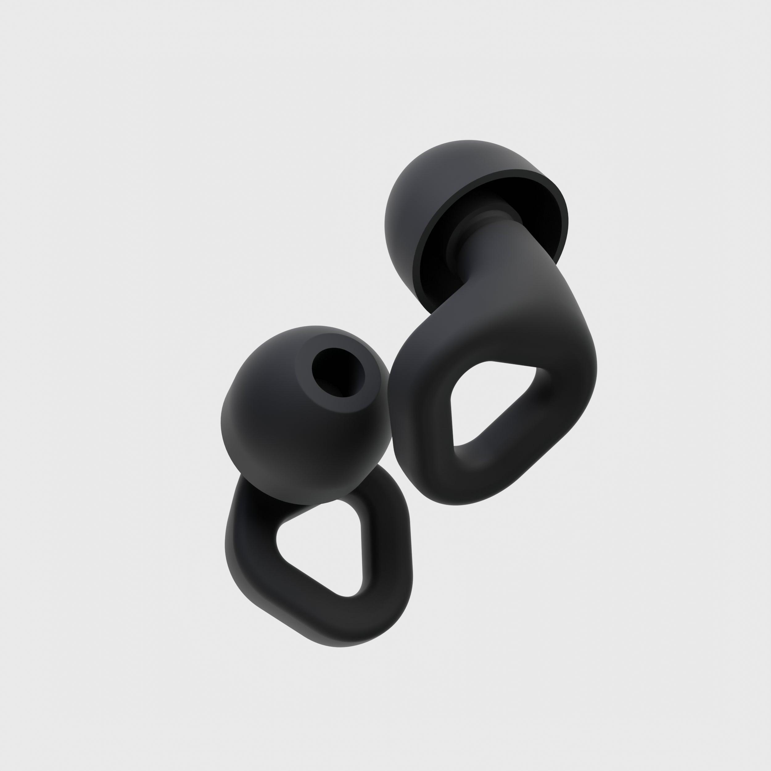 Close-up of Zenz Unwind black silicone earplugs showcasing their ergonomic design and superior noise-canceling features