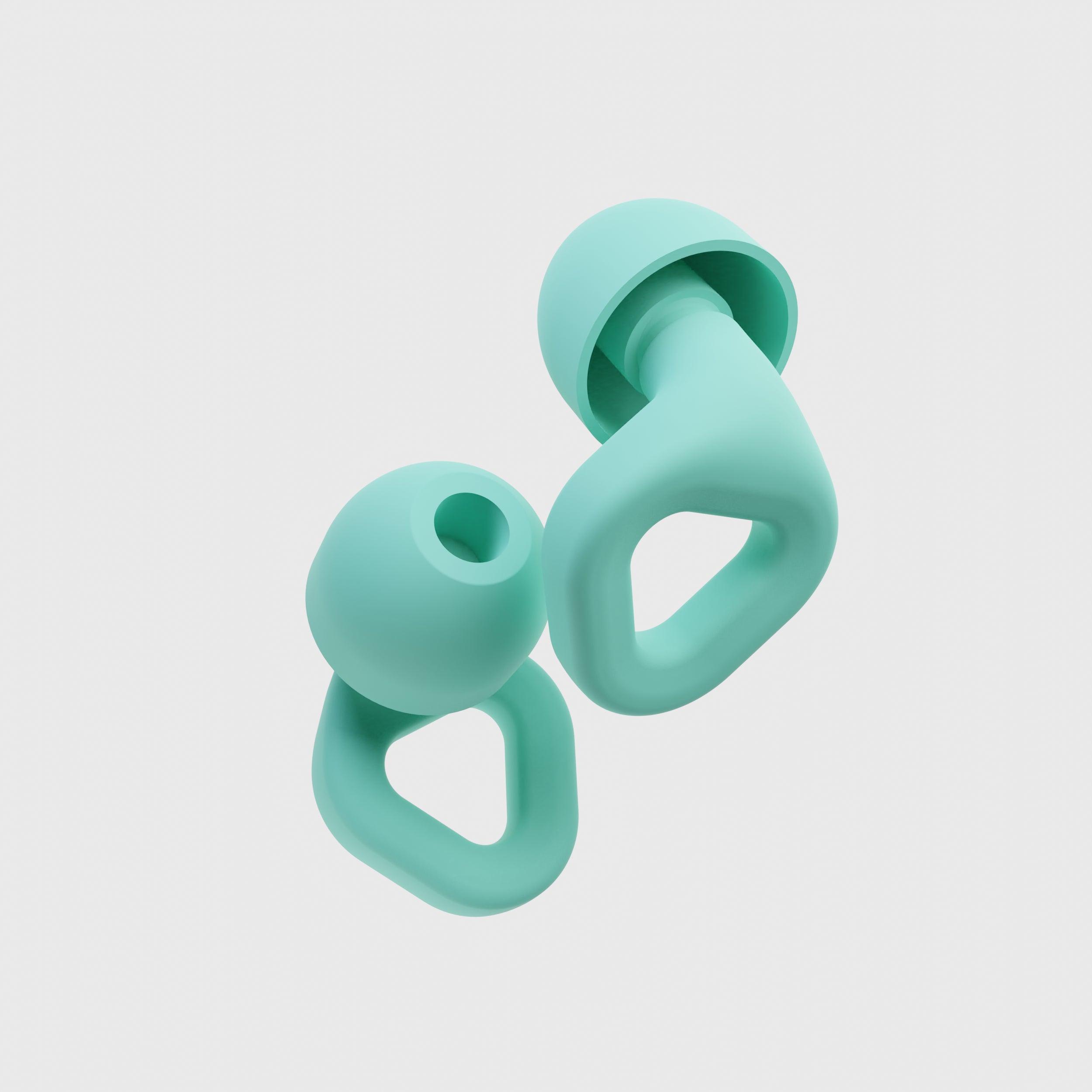 Close-up of Zenz Unwind mint green silicone earplugs showcasing their ergonomic design and superior noise-canceling features